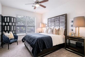 Spacious bedrooms with plush carpeting and expansive windows allowing natural light